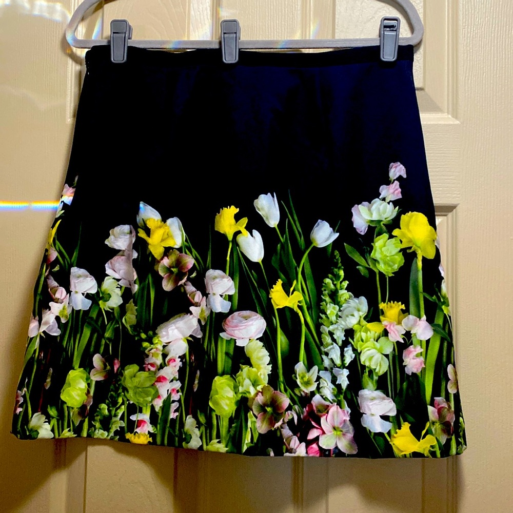 Victoria, Beckham skirt, black with bright, yellow and green flowers size large
